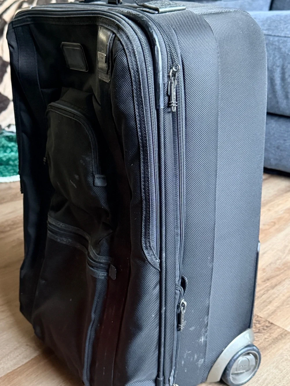 Tumi Black Rolling Suitcase with Front Pocket